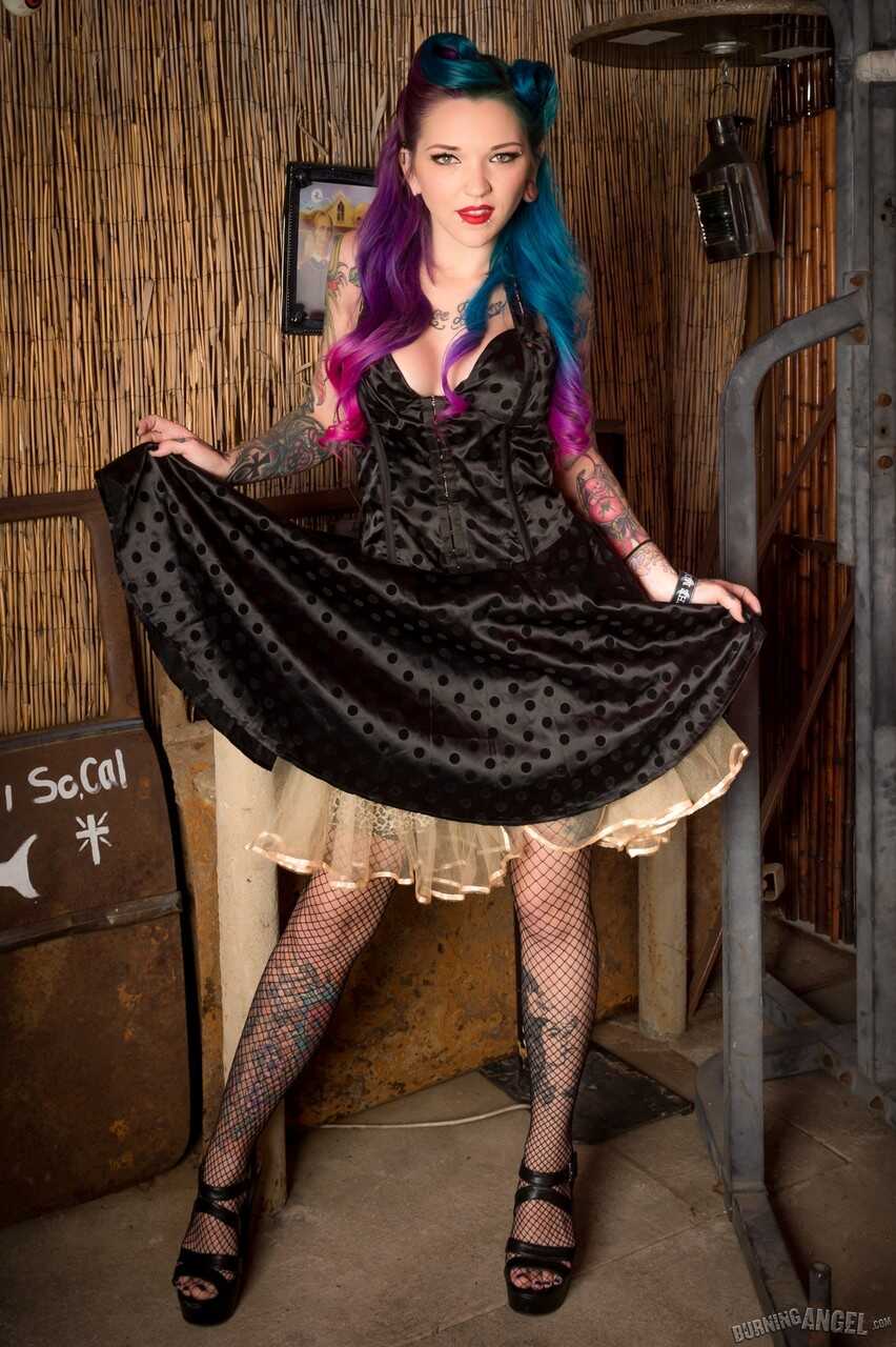 Tattooed Kandy Kummings in heels and fishnet stockings spreading her ass for your pleasure - Kandy Kummings
