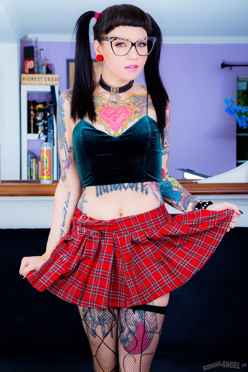 Tattooed Necro Nicki in pigtails & short skirt on knees showing tight ass - Necro Nicki