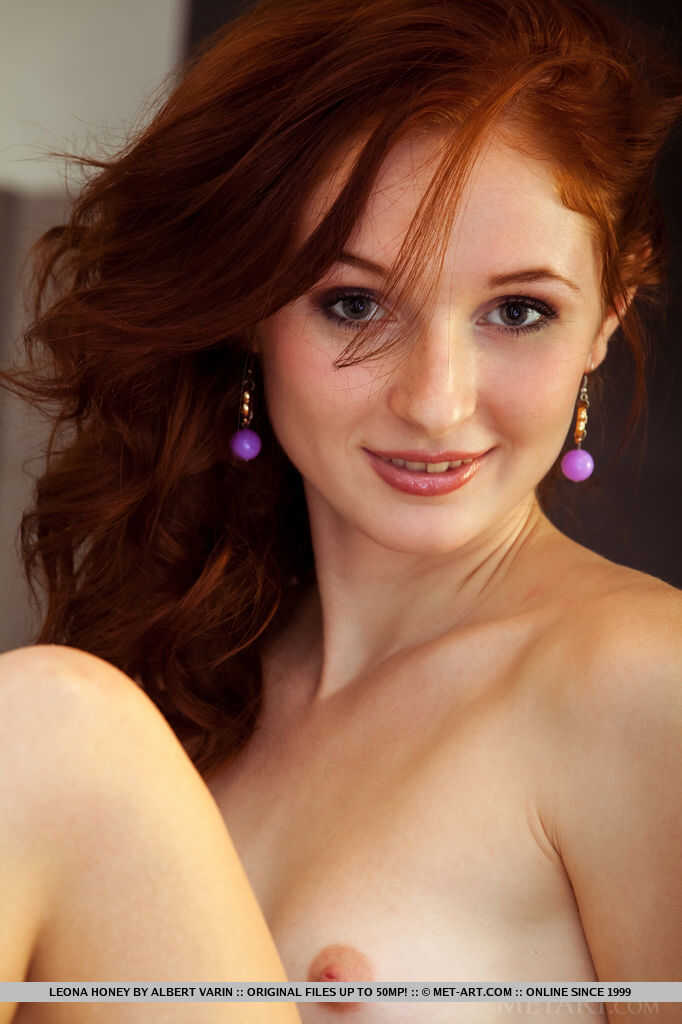 Redheaded teen babe Leona Honey baring her tight ass and perfect pussy for the glamorous camera. - Leona Honey