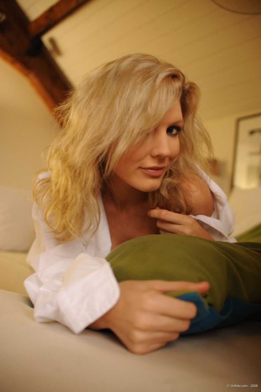 Blonde model Holly Newberry removes a man's white shirt to reveal her sexy assets - Holly Newberry