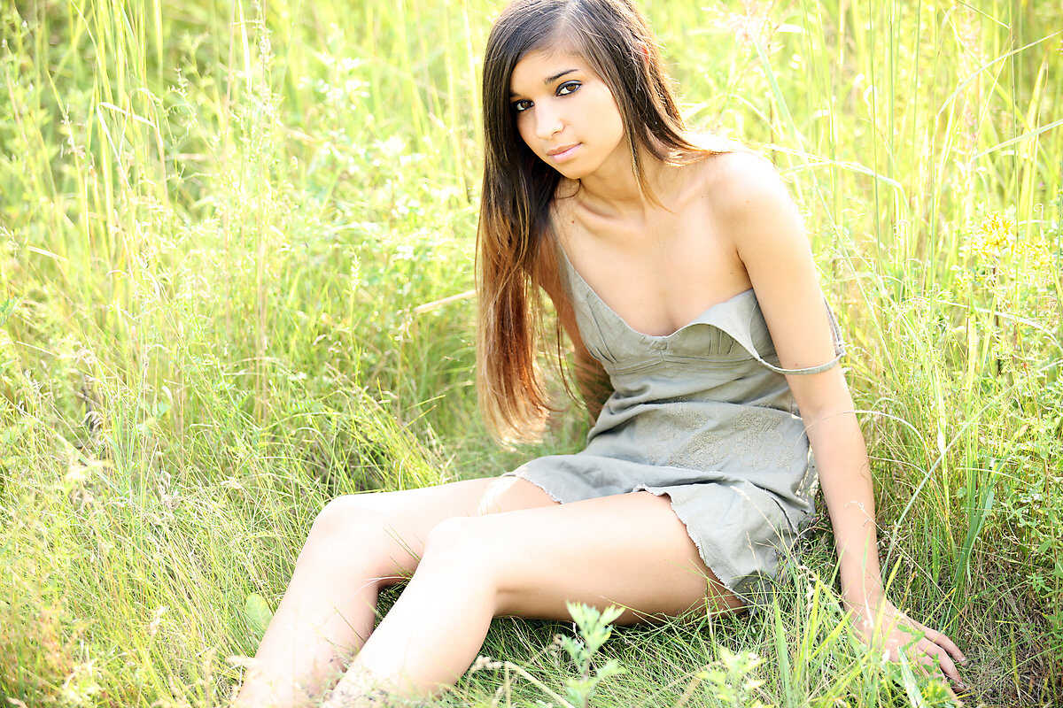 Naughty Nika on the Green Grass: An Alluring Brunette's Seductive Showcase of Her Tight Slit and Curvy Body 