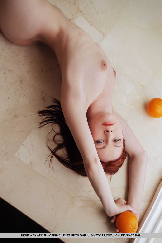 Pale redhead Night A in lace lingerie spreading long legs for the camera as she teases with her bald twat and inviting pus...