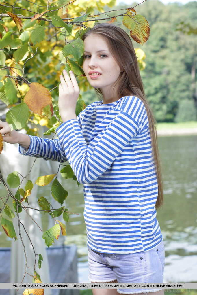 Hot teen Victoriya A flaunting her hairy pussy at the park to show off her small tits.