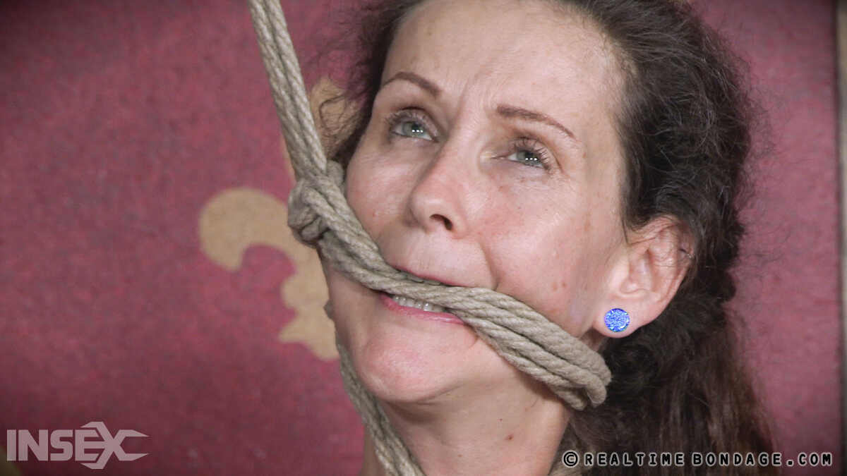 White girl Paintoy Emma endures sensory deprivation during BDSM play while wearing latex and MILF pantyhose, with her hair...