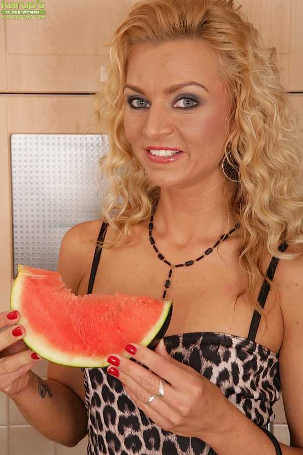 Blonde Sophia Magic Bites into a Watermelon Before Stripping Down and Showing Off Her Juicy Big Ass in Front of the Camera...
