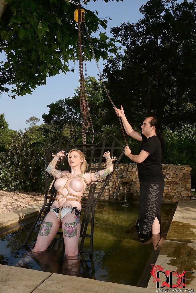 Jolly babe with big tits Hollie Hatton getting tied up and ravished outdoors by her neighbor while showing off her wet tit...