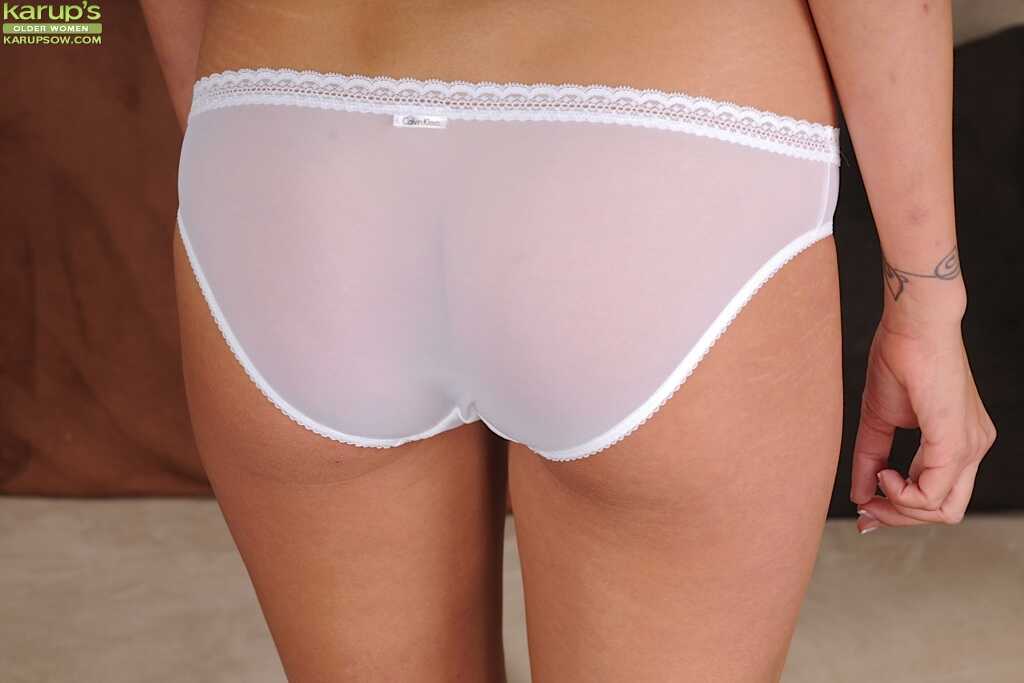 Brunette mature babe June undressing her boobs and cute ass for you June Tandy's naughty moment! - June Tandy