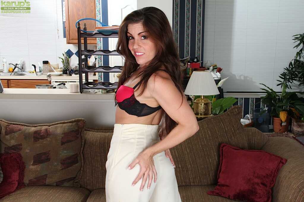 Brunette Annabelle Genovisi is taking off her lingerie and dress while masturbating in the see-through lace panties - Anna...