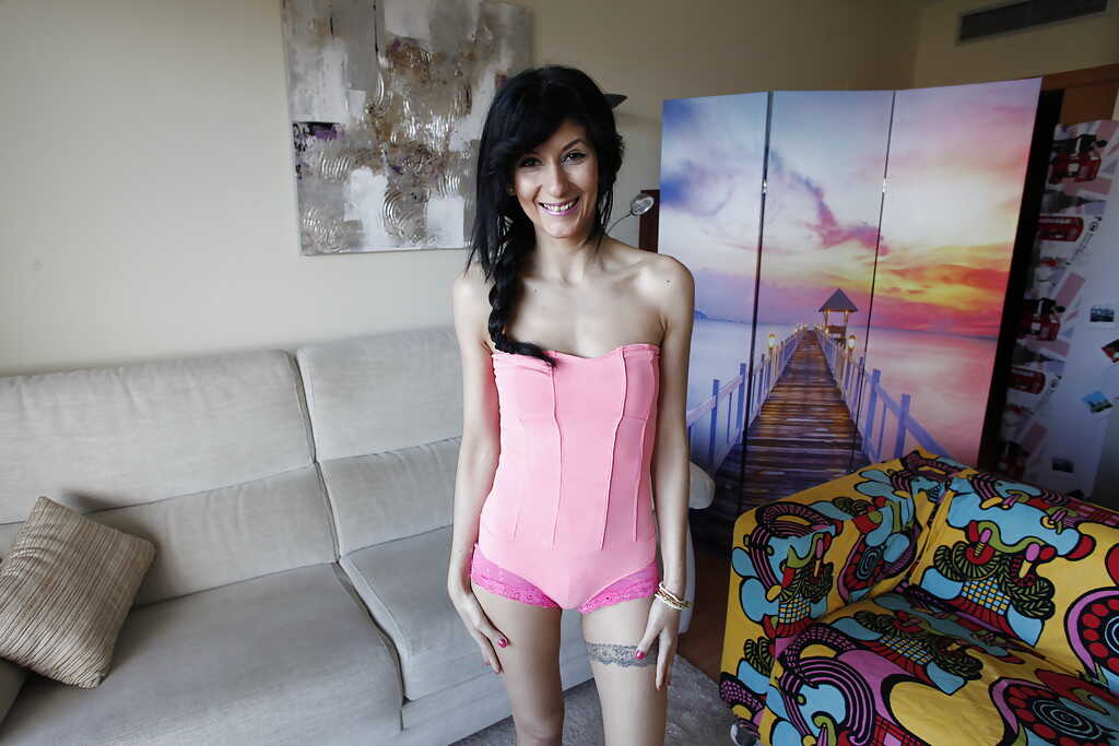 Slim tattooed milf Megan Hot strips and exposes her thin frame in lingerie with a small pair of tits, teasing you with her...