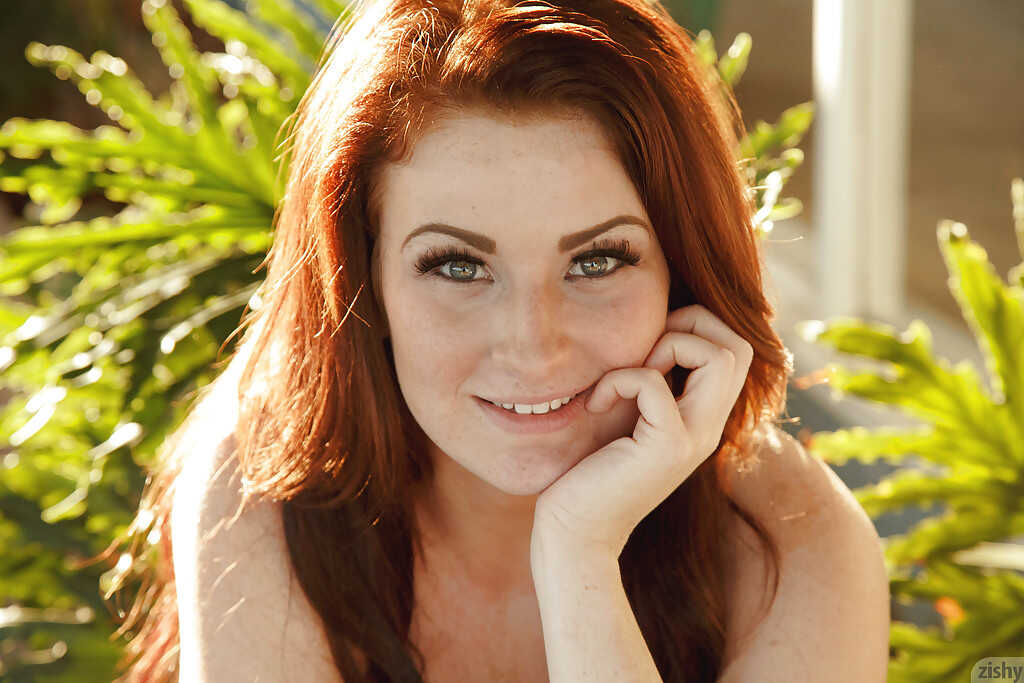 Amateur redhead Emmy Sinclair poses in bikini outdoors for hot scenes with her big natural tits and busty ass. - Emmy Sinc...