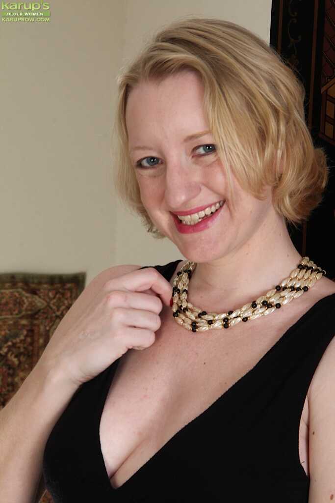 Blonde mature wife Anya Volcov posing in black stockings and heels with her big tits and pussy on display - Anya Volcov