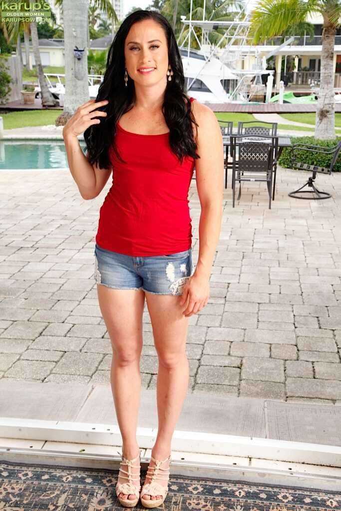 Dark haired solo girl Aerial Cruz baring small Latina MILF breasts in the garden - Aerial Cruz