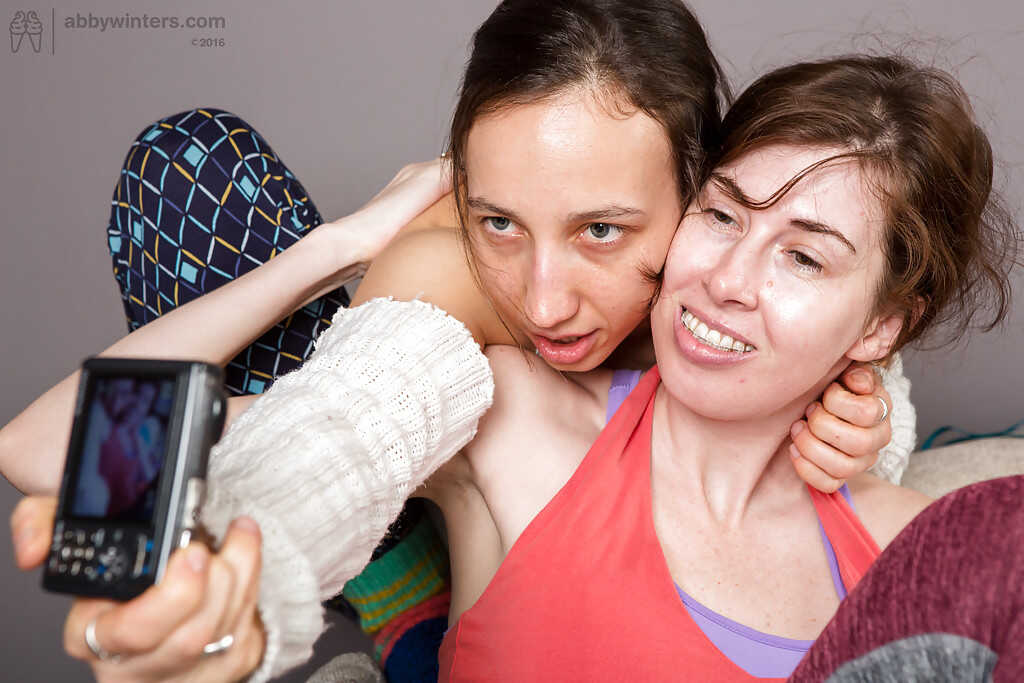 Young and Curious: Brunette lesbian lovers explore each other's small tits and hairy pussies before indulging in swee...