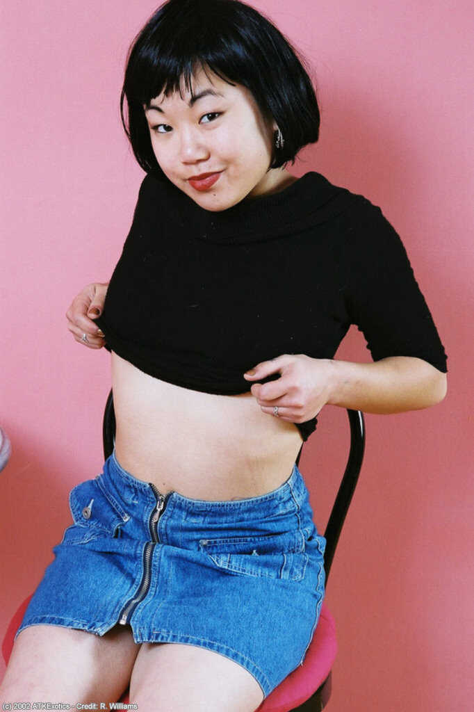 Asian Junko's hairy pussy lips fold back as she removes her skirt to showcase her big tits and curvy ass! - Junko
