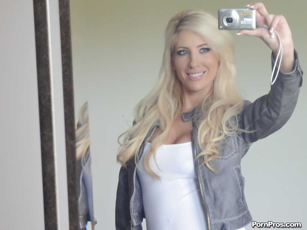 Platinum blonde beauty Tasha Reign taking selfies while getting naked and posing seductively in the mirror for her hot gir...