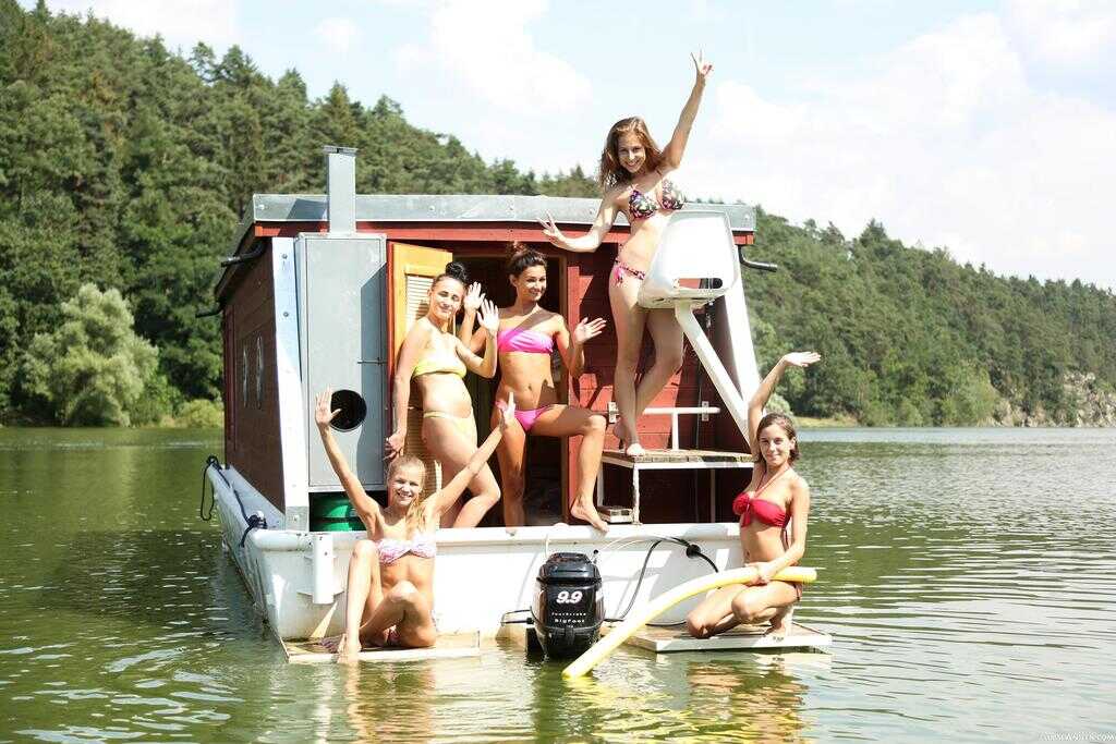 Naked River Nymphs: A Group of Nude Teenage Girls on a Raft in the Wilderness 