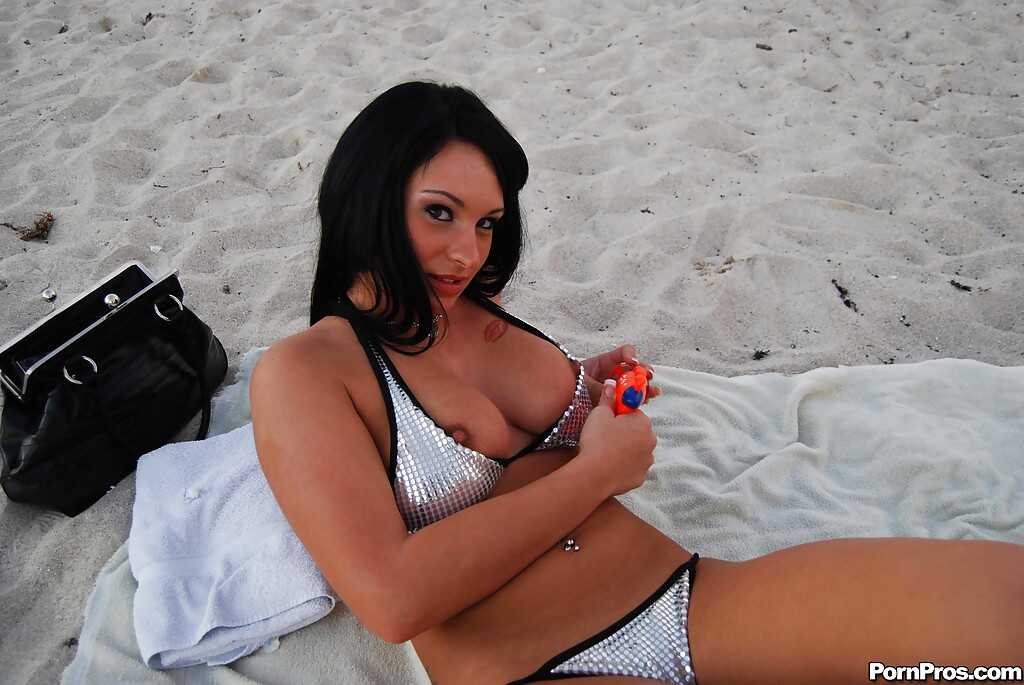 Busty Kitty Bella spreads her legs wide open in her sexiest bikini, showing off her ass for all to see. - Kitty Bella