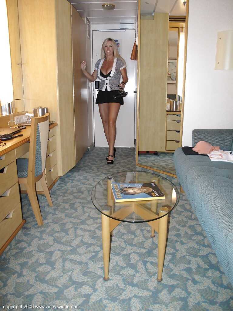 Sexy MILF Sandra shows off her big tits and beautiful body on the beach in glasses and an upskirt - Sandra Otterson