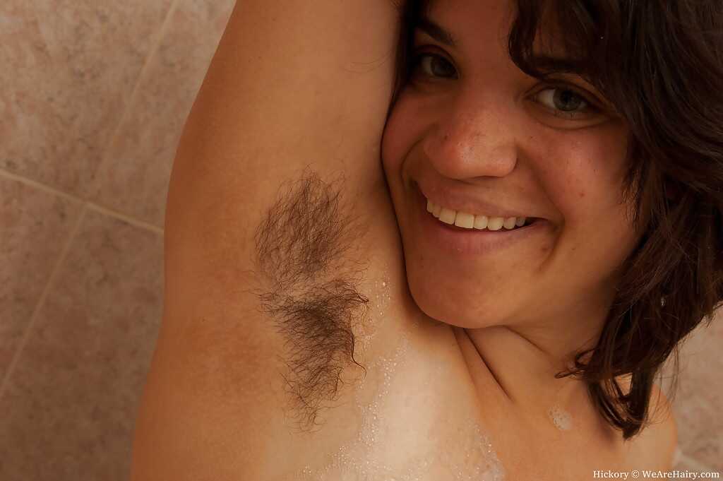 Hairy MILF Hickory Strips Off her Clothes to Show off her Busty Body and Shaved Pussy in the Bathroom