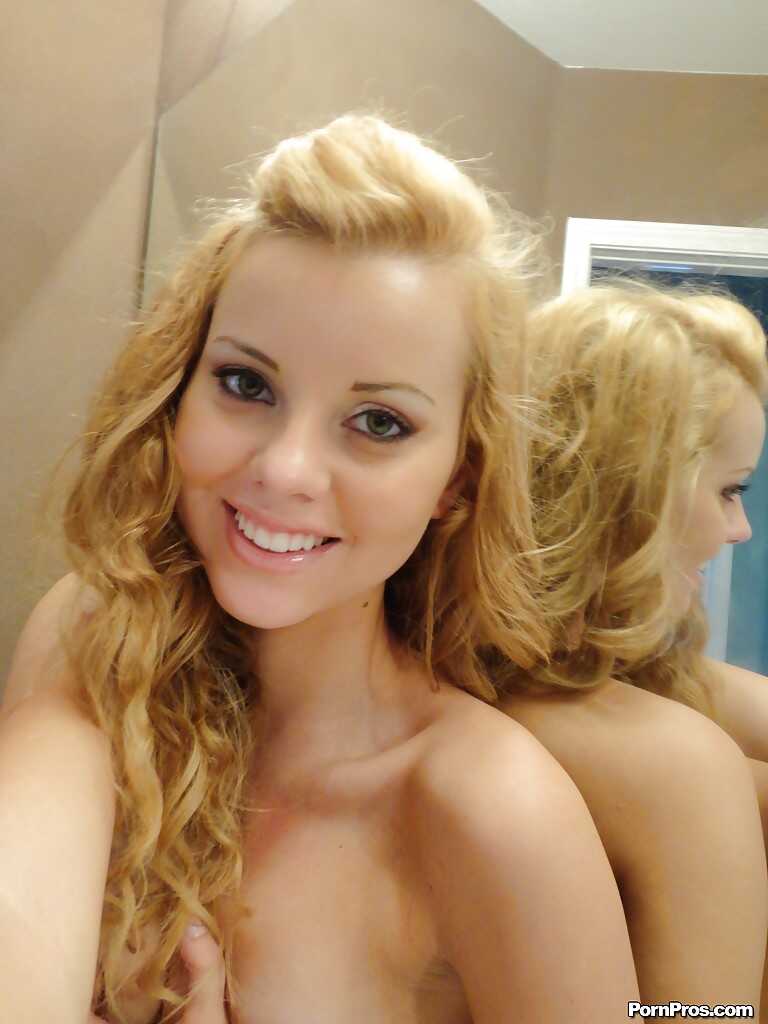 Busty Jessie Rogers strips naked, ass in the air, as she daydreams about hot sex