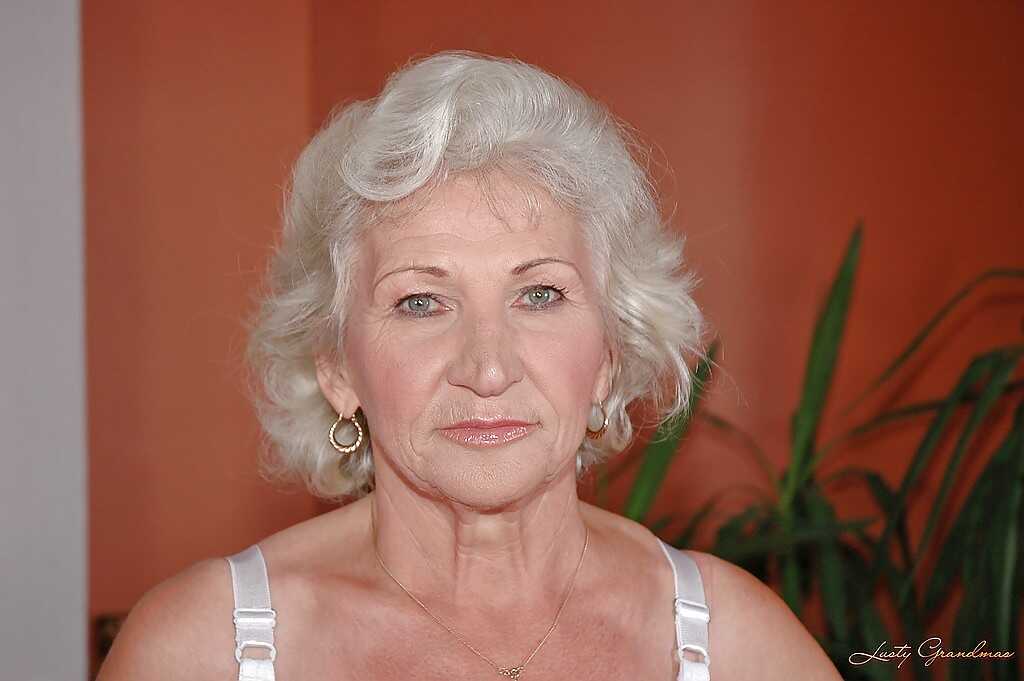 Norma's Lustful Masturbation in White Stockings and a Big Dildo: A Granny Porn Image - Norma