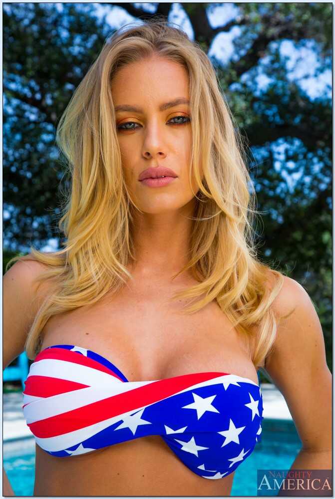 Loveable blonde babe Nicole Aniston spreading her legs and showing off her perfect pussy while taking off her bikini by th...