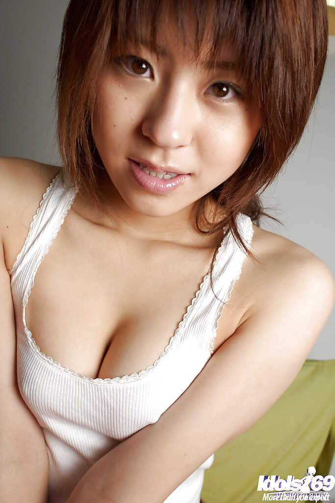 Pretty asian teen Haruka Tsukino's hairy pussy slips out of her tight japanese panties while she naughtily smiles at ...