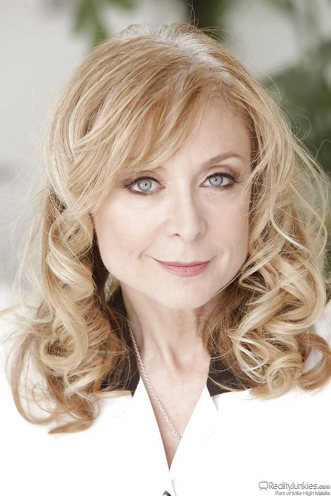 Nina Hartley's Seductive Undress: Unveiling Her Mature Stockings, Blonde Hair and Leggy Lingerie - Nina Hartley