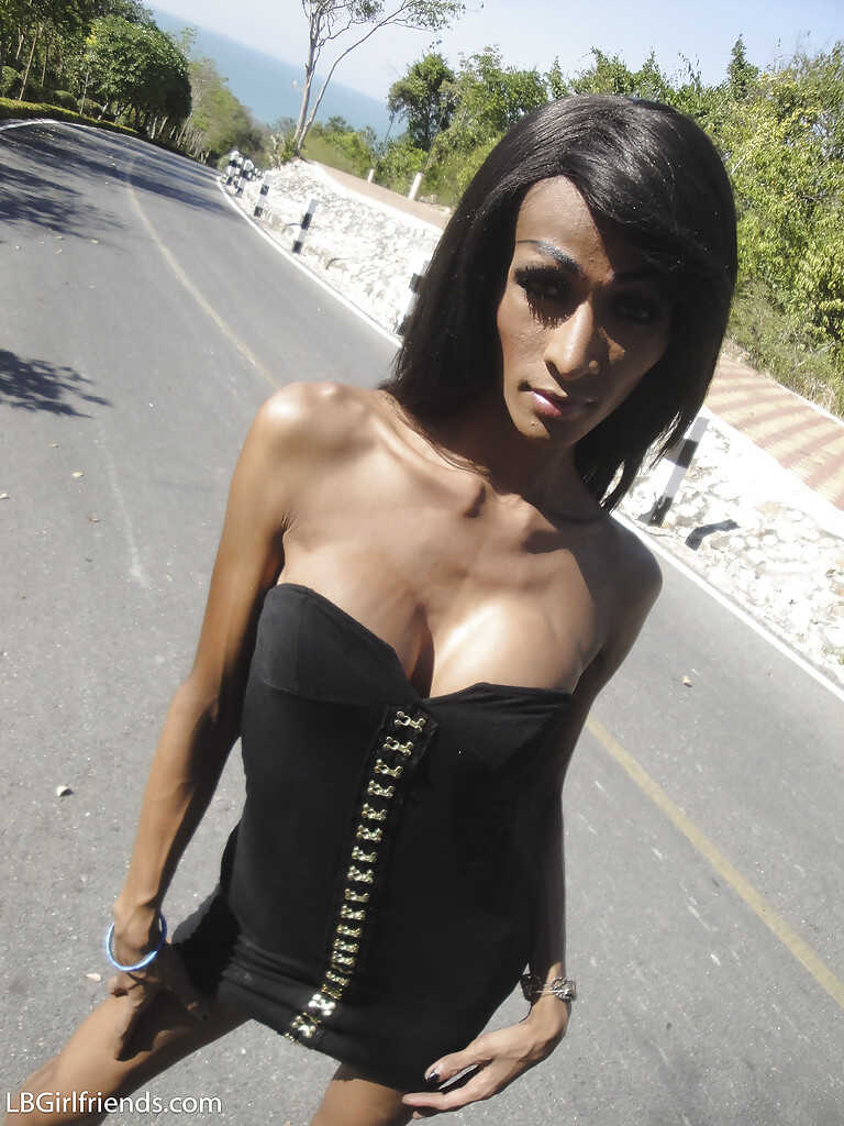Asian shemale goddess Tina squeezes out a massive dick from her tight latex crotch while wearing sky-high stilettos - 
