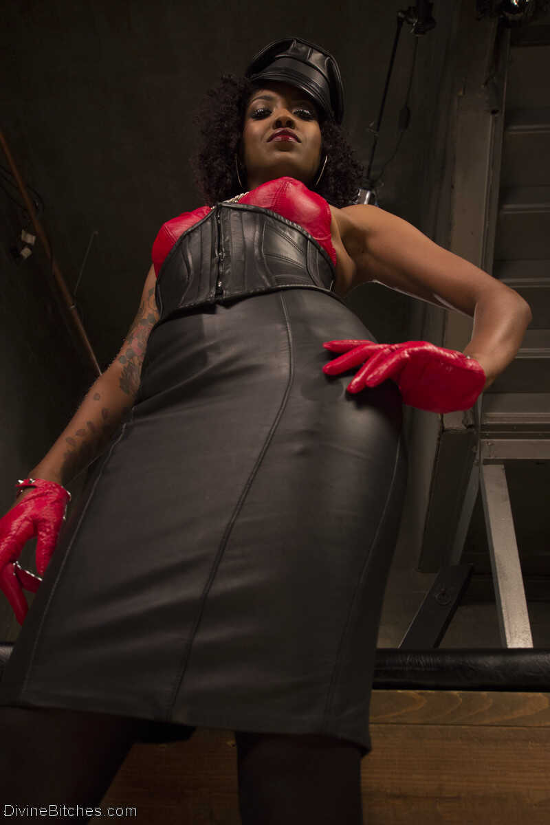 Leather-clad ebony femdom mistress Lotus Lain revealing her tiny tits and nipples - Alexander Gustavo, Lotus Lain