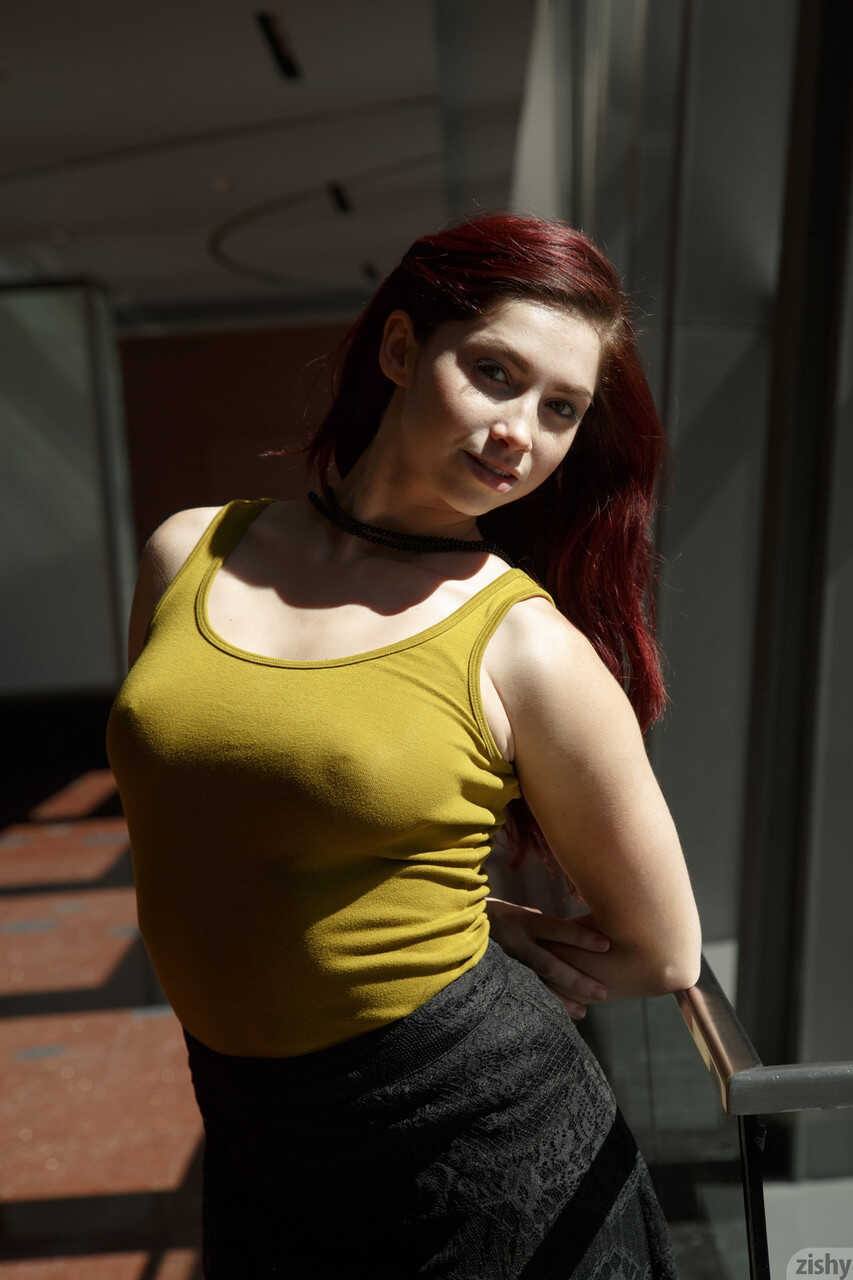 Redheaded babe Jazz Reilly gets naughty with her flexible body and teases you with an upskirt show - Jazz Reilly