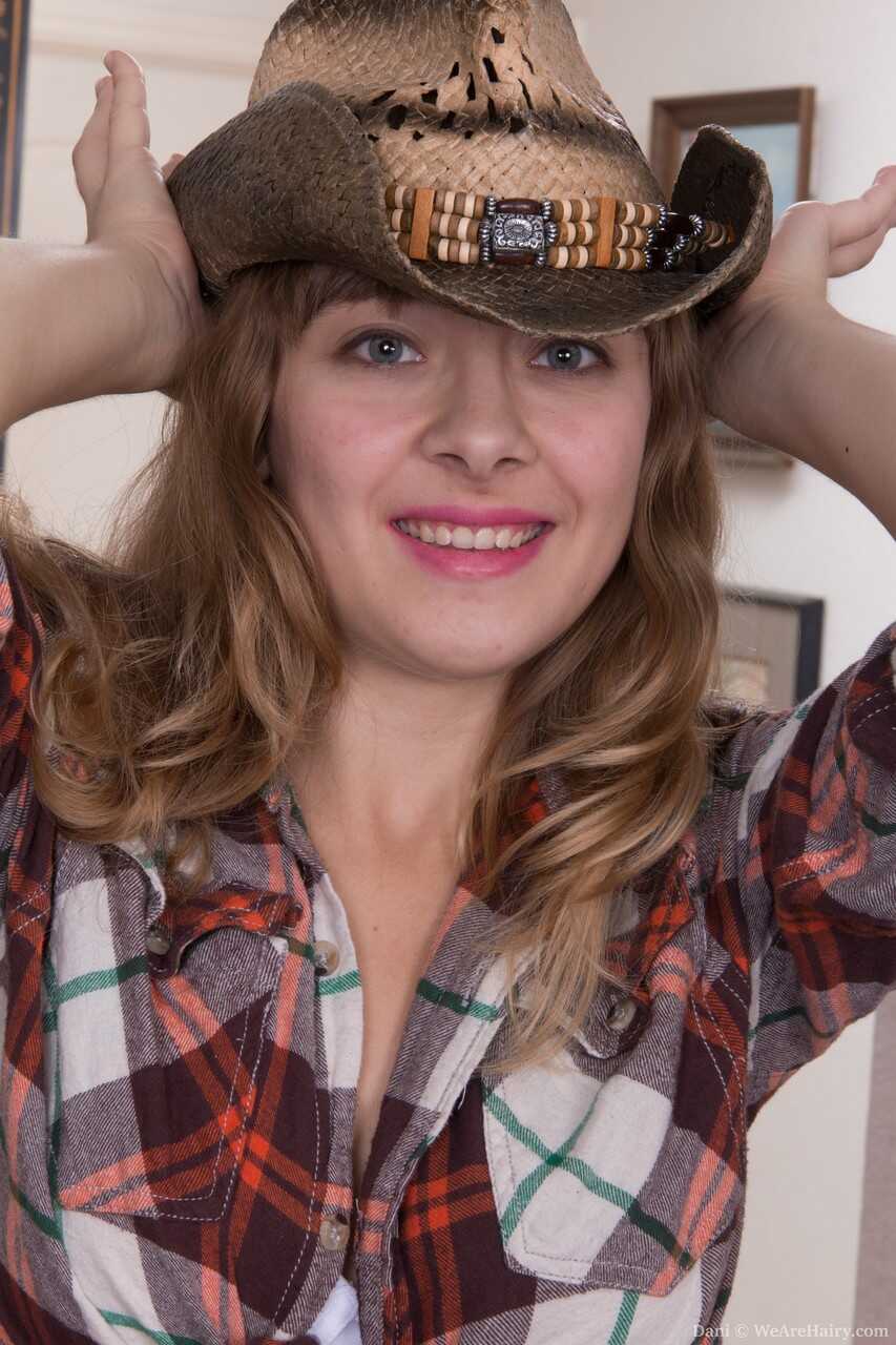 Busty cowgirl Dani's hairy pussy massage leaves you breathless!