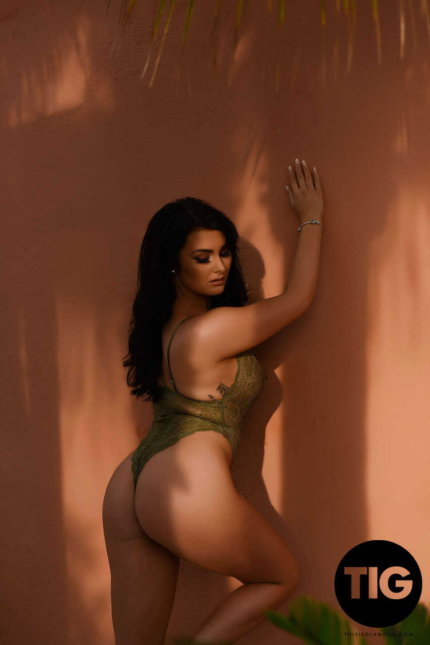 Curvaceous British model Ashleigh Gee strips down to her sheer bodysuit and poses outside, teasing with her big natural ti...