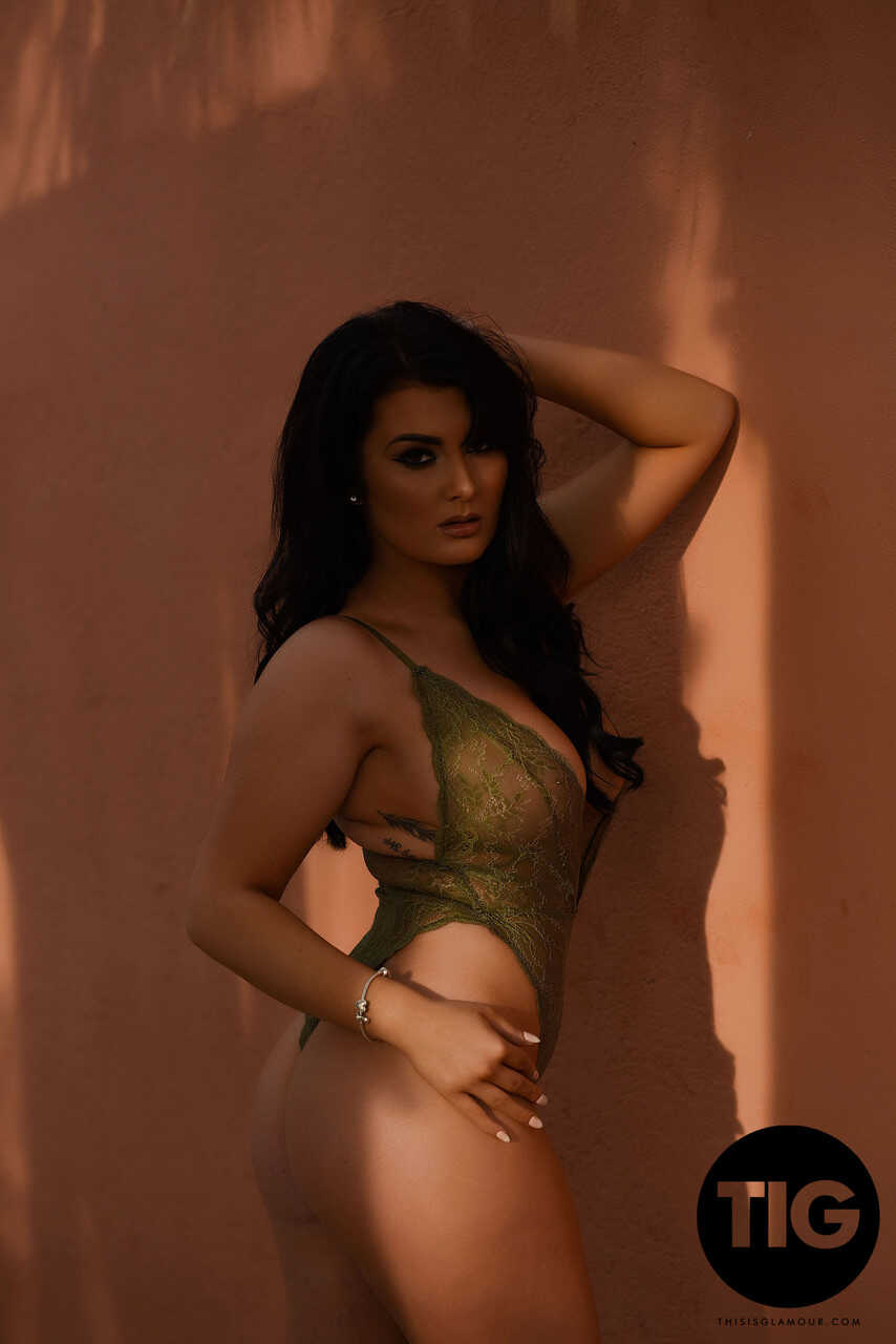 Curvaceous British model Ashleigh Gee strips down to her sheer bodysuit and poses outside, teasing with her big natural ti...