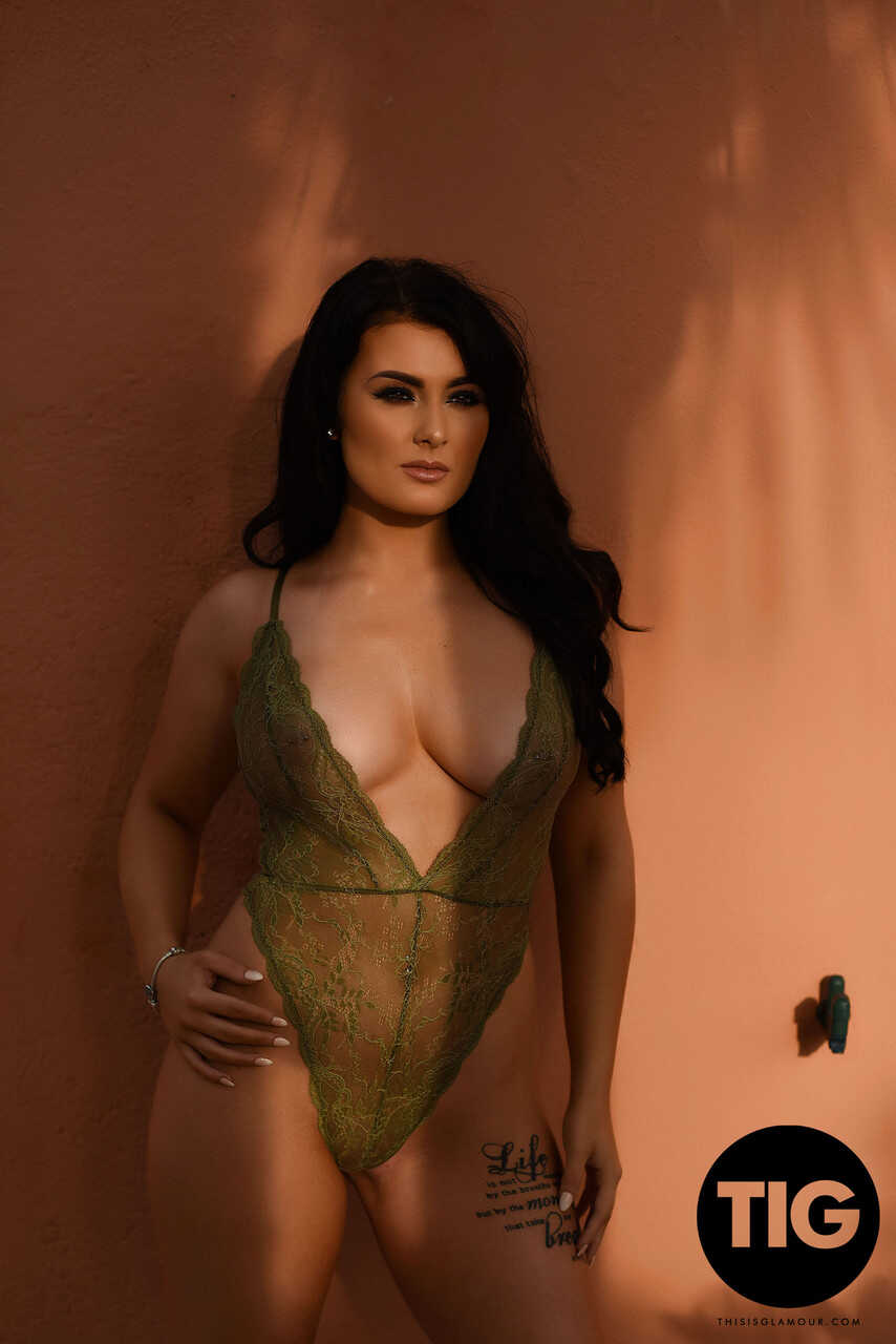Curvaceous British model Ashleigh Gee strips down to her sheer bodysuit and poses outside, teasing with her big natural ti...