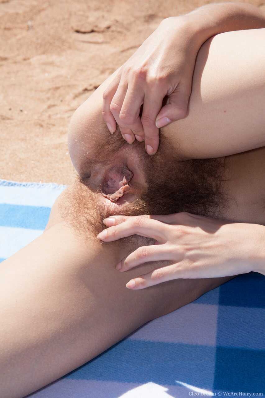 Hairy brunette Cleo Dream's raunchy beach masturbation session with her meaty lips and big labia exposed! - Cleo Dream