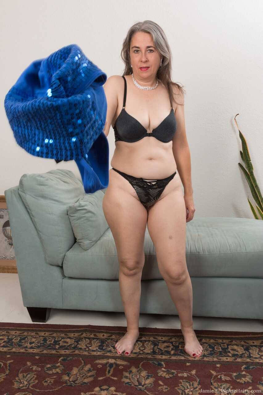 Mature Brunette Jamie Unleashes Her Hairy Bush on a Couch - Olivia Olay