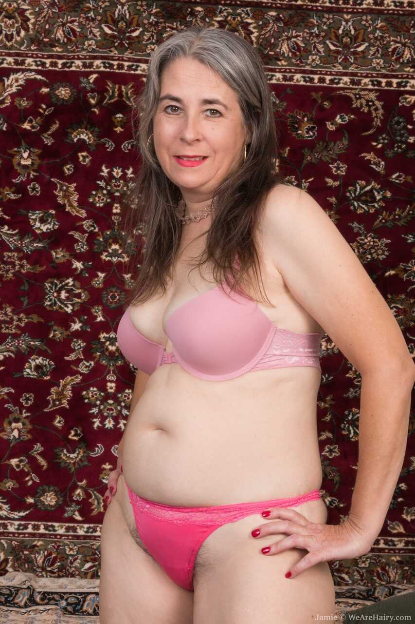 Mature with a hairy pussy Jamie shows her saggy boobs and poses on a couch  MILF on the Couch - Jamie