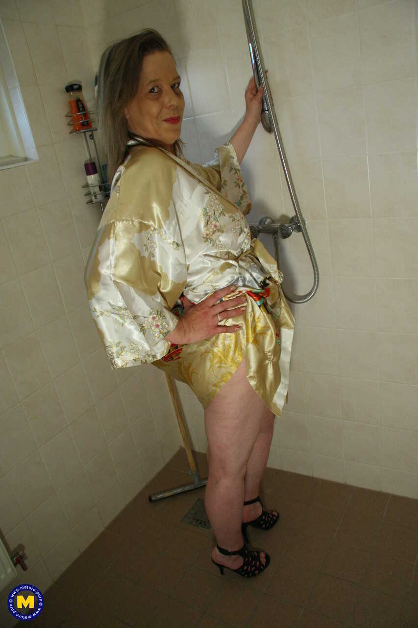 Mature housewife Marleen fingers her horny pussy while standing : The Naughty Older Woman's Pleasure - Marleen