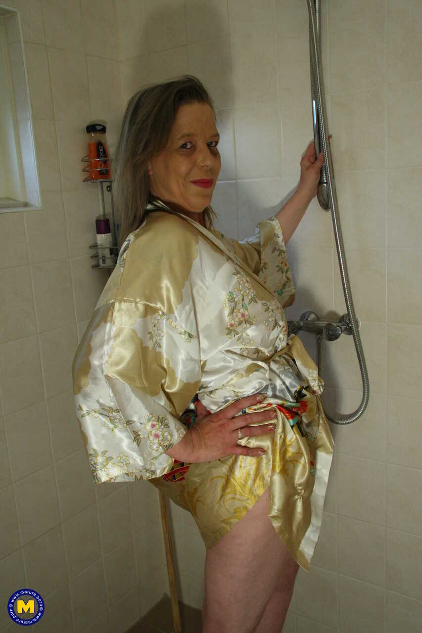 Mature housewife Marleen fingers her horny pussy while standing : The Naughty Older Woman's Pleasure - Marleen