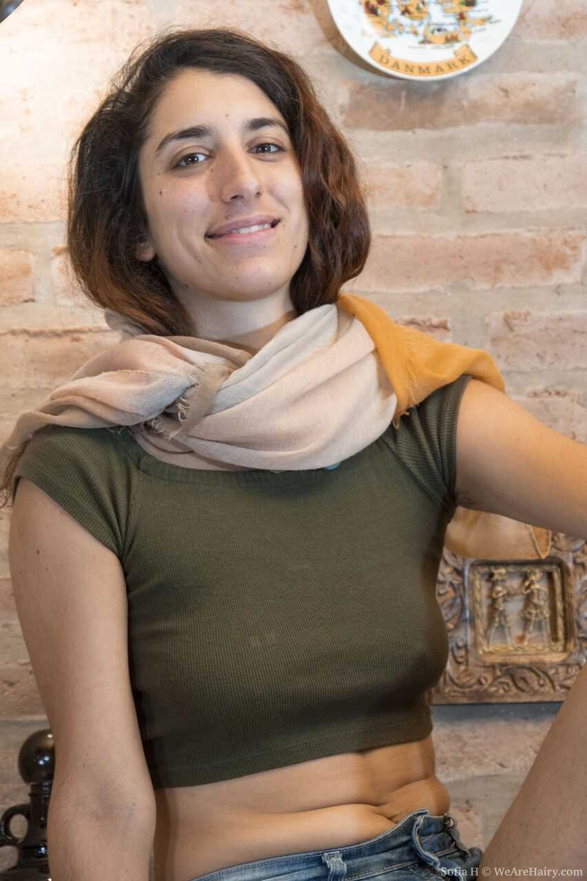Sofia H's Furry Vagina on Display: A Cute Hippie Amateur with Hard Nipples and an Erect Pussy on a Wooden Desk - Sofia H