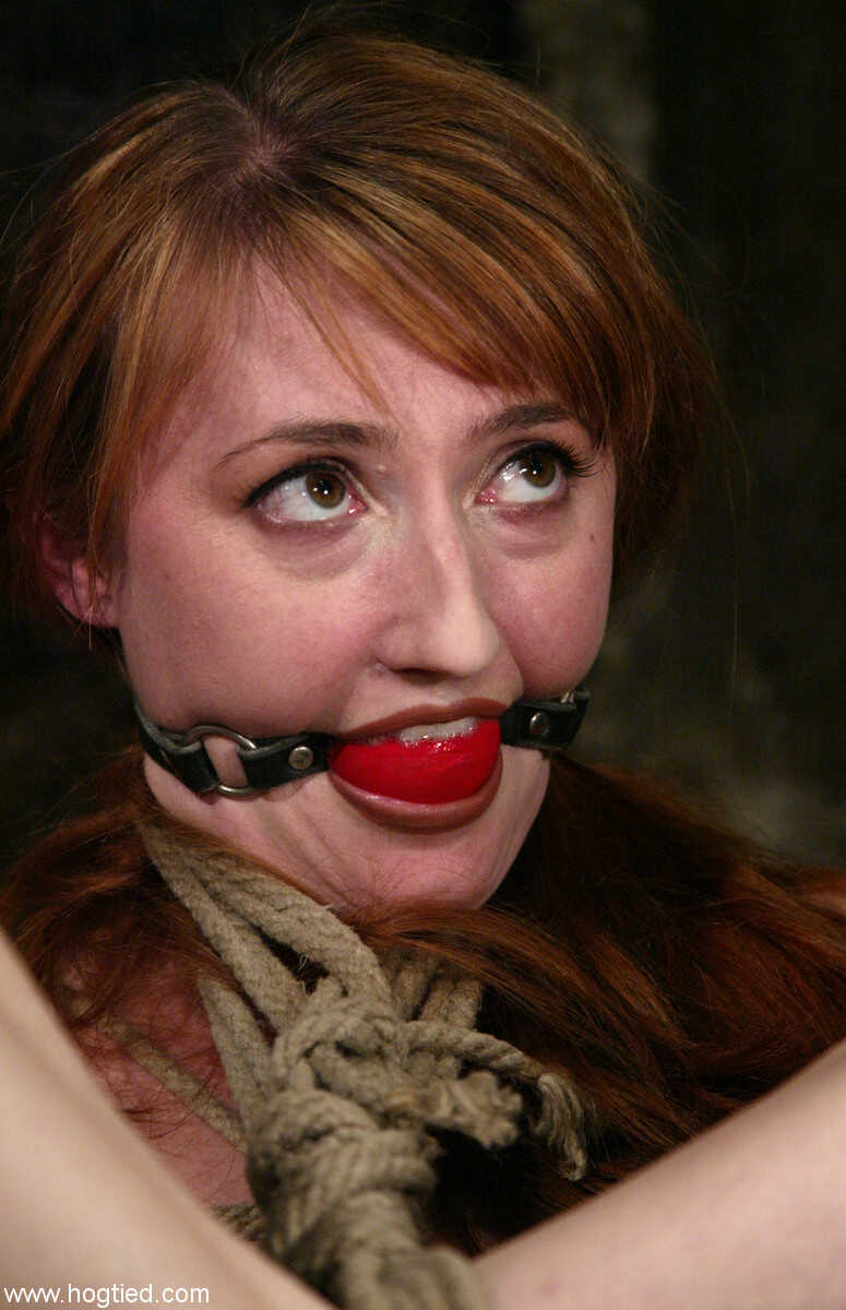 Redheaded babe Kendra James gets tied up, gagged and ravaged by two rough men in the basement - Kendra James