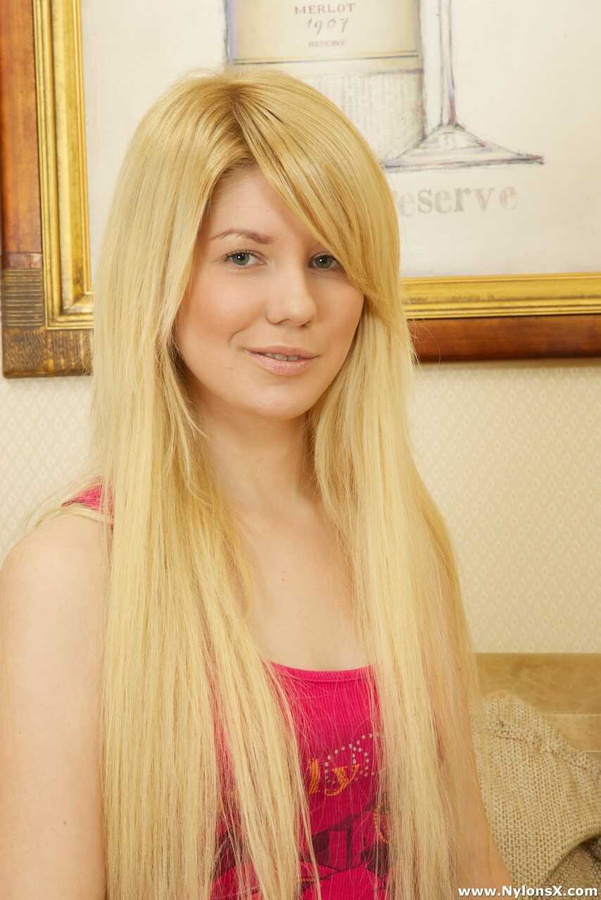 Blonde teen Autilia takes a stiff rod from behind on a couch while sucking cock in pantyhose - Autilia