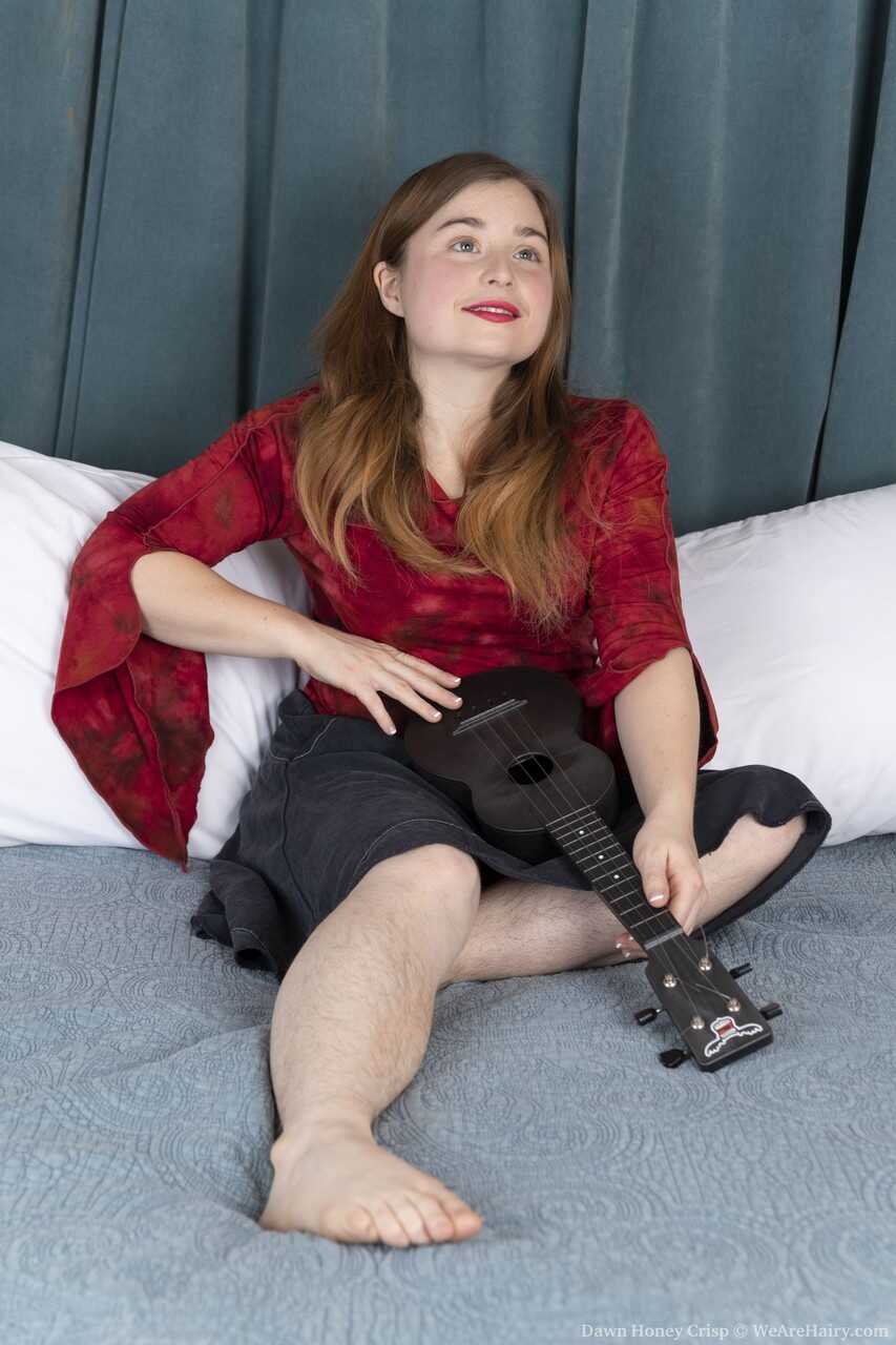 Petite hairy Dawn Honey Crisp strums her guitar while playing with her shaved pussy - Dawn Honey Crisp