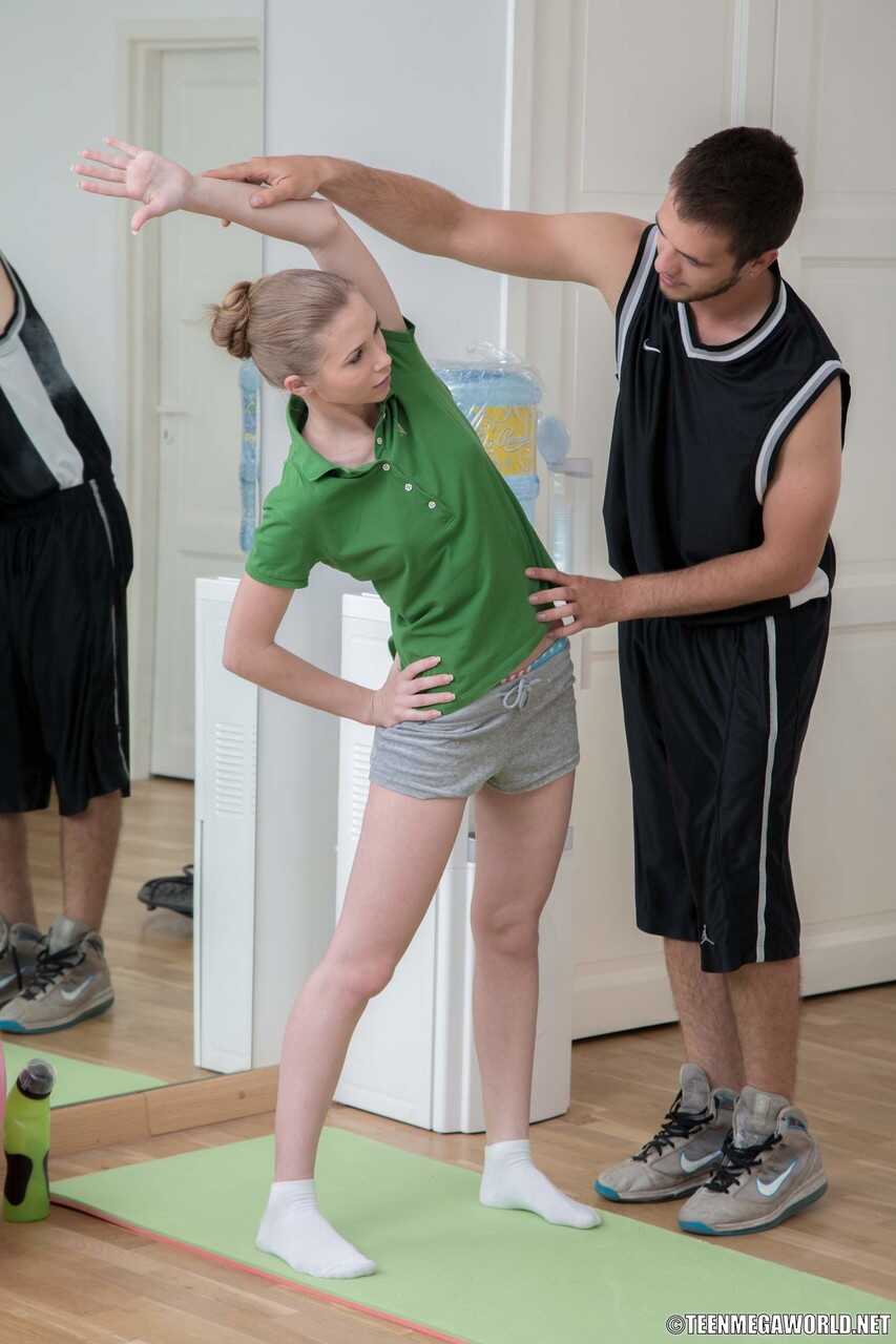 Sexy teen Kortny gets her gym shorts stripped and then ridden hard on the mat by a hung fitness instructor! - Kortny