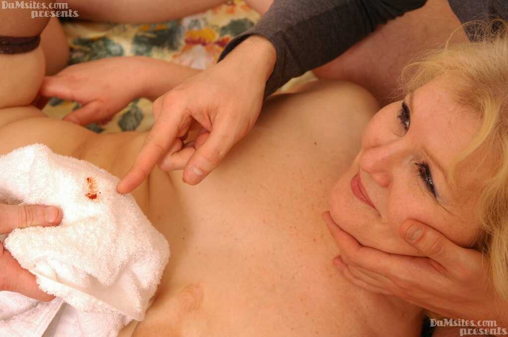Blonde milf with mature pussy takes two young guys' stiff rods for a wild ride - 