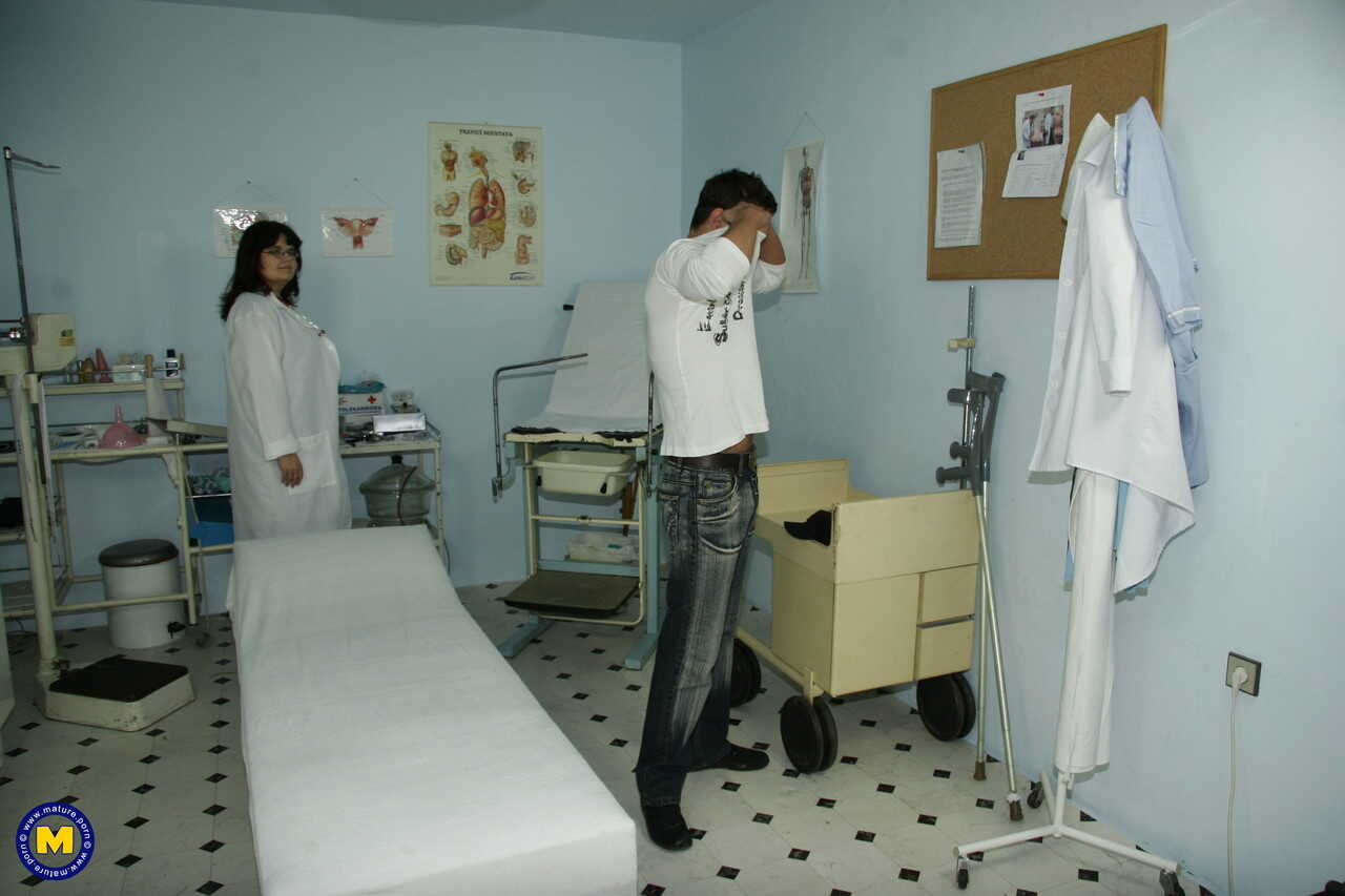 Dark-haired MILF nurse Uma teases her young patient's cock until he can't resist fucking her tight pussy - Uma