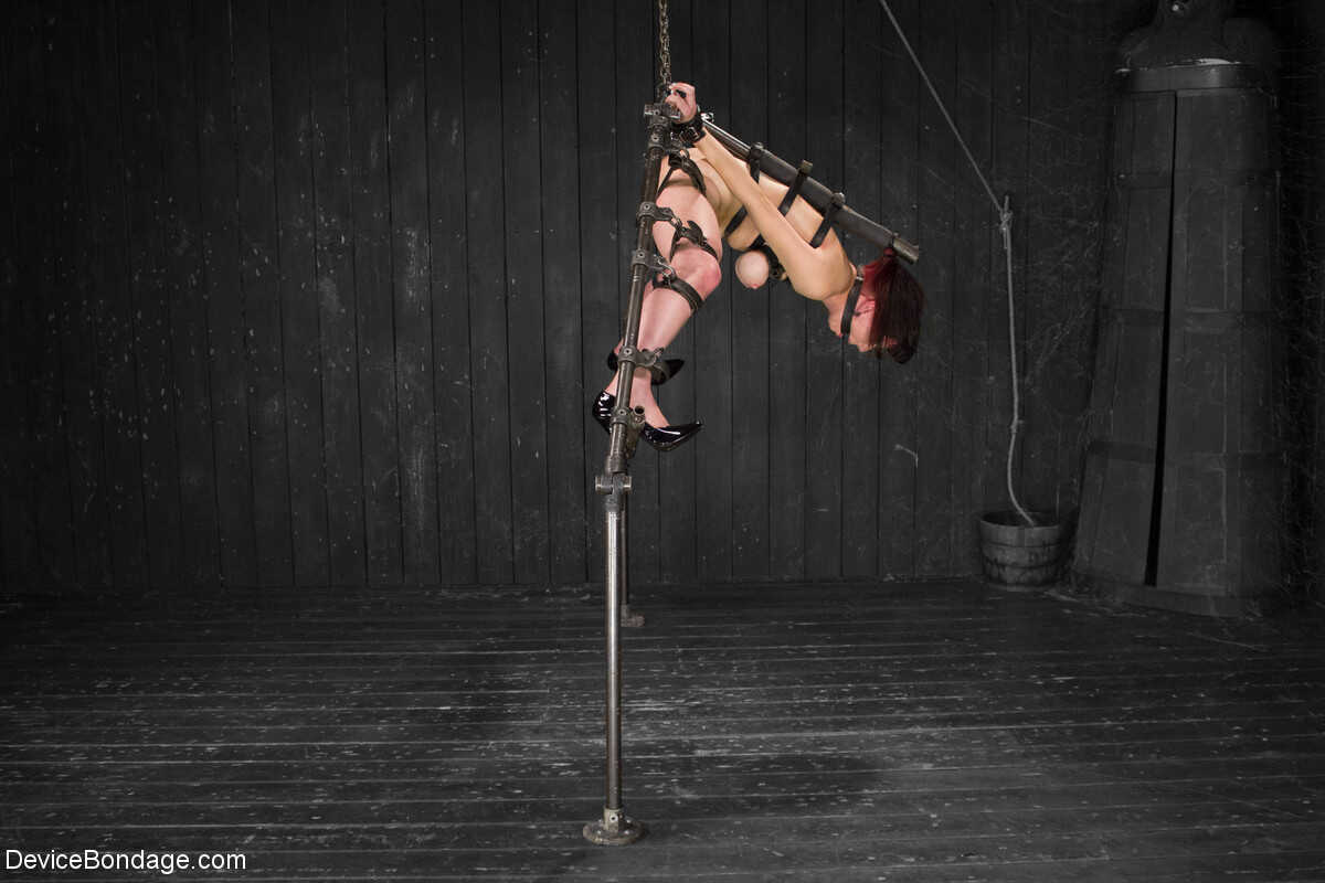 Redhead Mistress Nerine Mechanique Gets Pounded by a Tooled Up Dildo While Hanging From The Ceiling - Nerine Mechanique