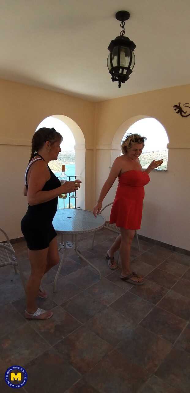 Curvaceous mature lesbians Camilla C & Pandora get intimate on vacation while enjoying a glass of wine.