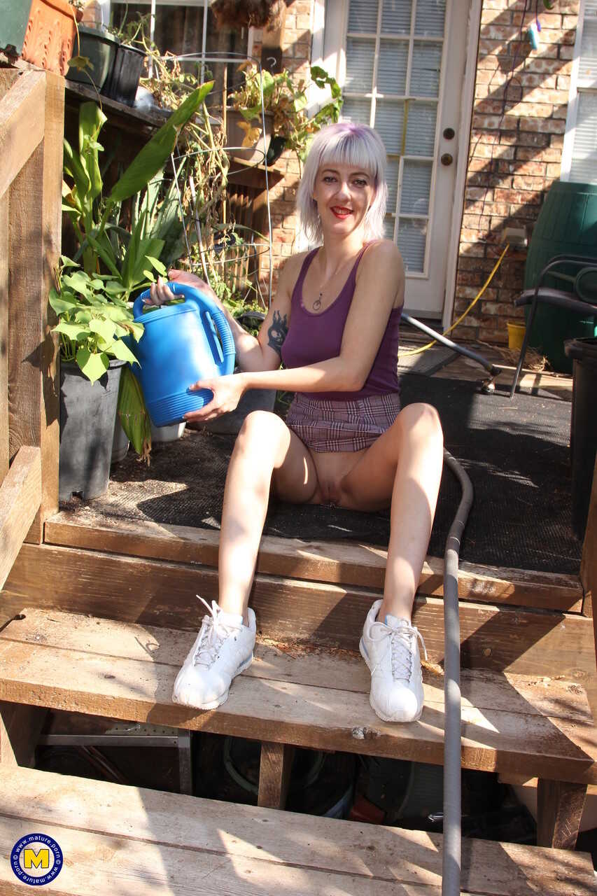 The Naughty Neighborhood Garden: Skinny Blonde Sylvie J Flashes Her Pussy In Public! - Sylvie J